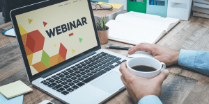 Webinar with computer and coffee