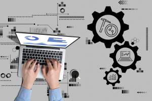 Person using a laptop with analytics on screen, surrounded by digital icons and gears symbolizing the functions and capabilities of EHR software for behavioral health management.