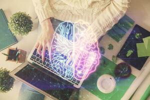 Mental health provider using the best mental health EHR software on a computer, representing streamlined documentation, billing, and patient engagement tools in 2025.