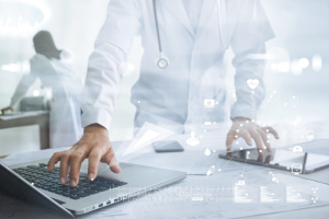 A clinician using an all-in-one EHR platform at a behavioral health facility, showcasing a unified dashboard for documentation, scheduling, billing, and patient engagement.